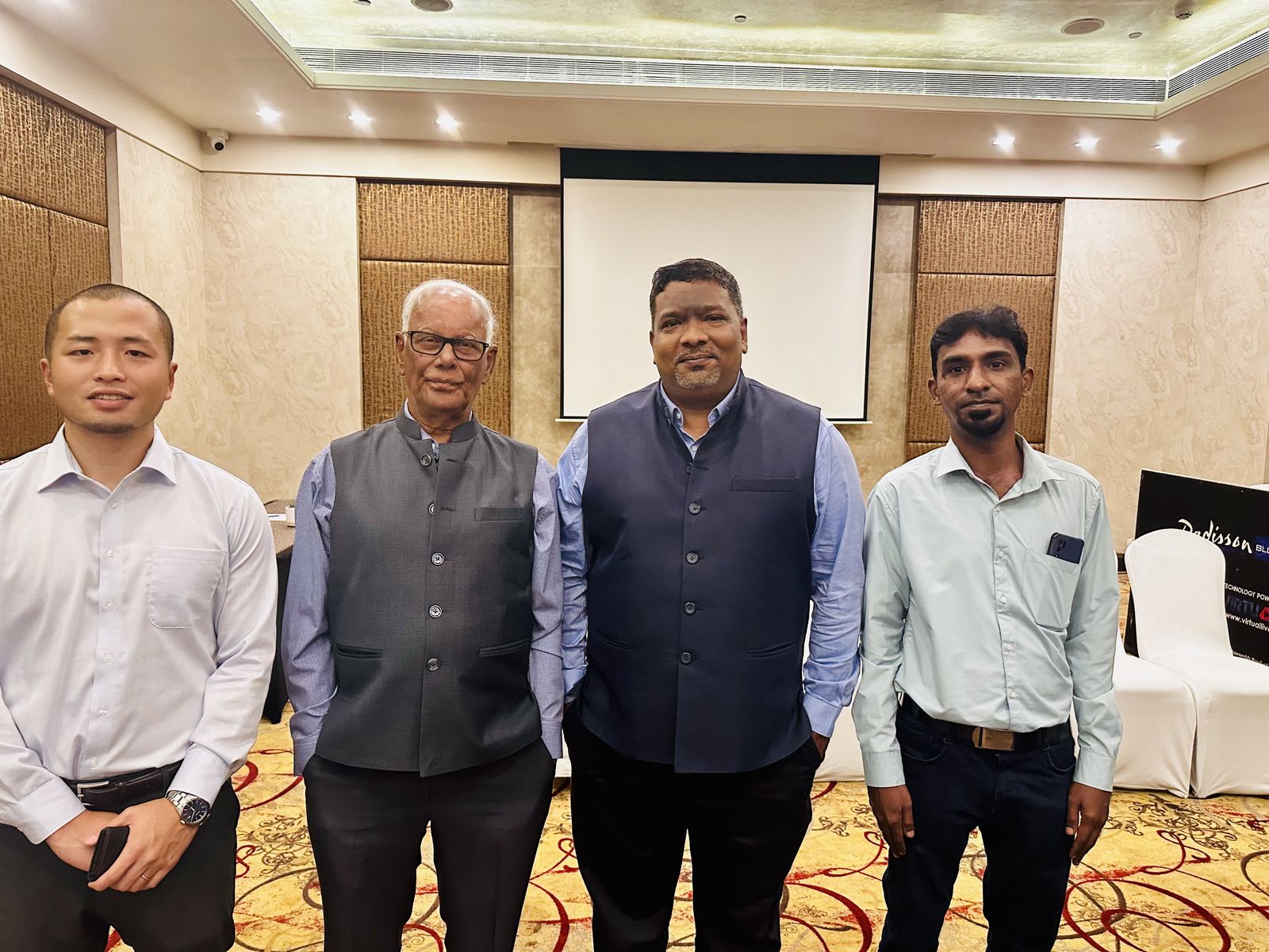 Venkatesh Kumar Pandurengan with colleagues in a conference room