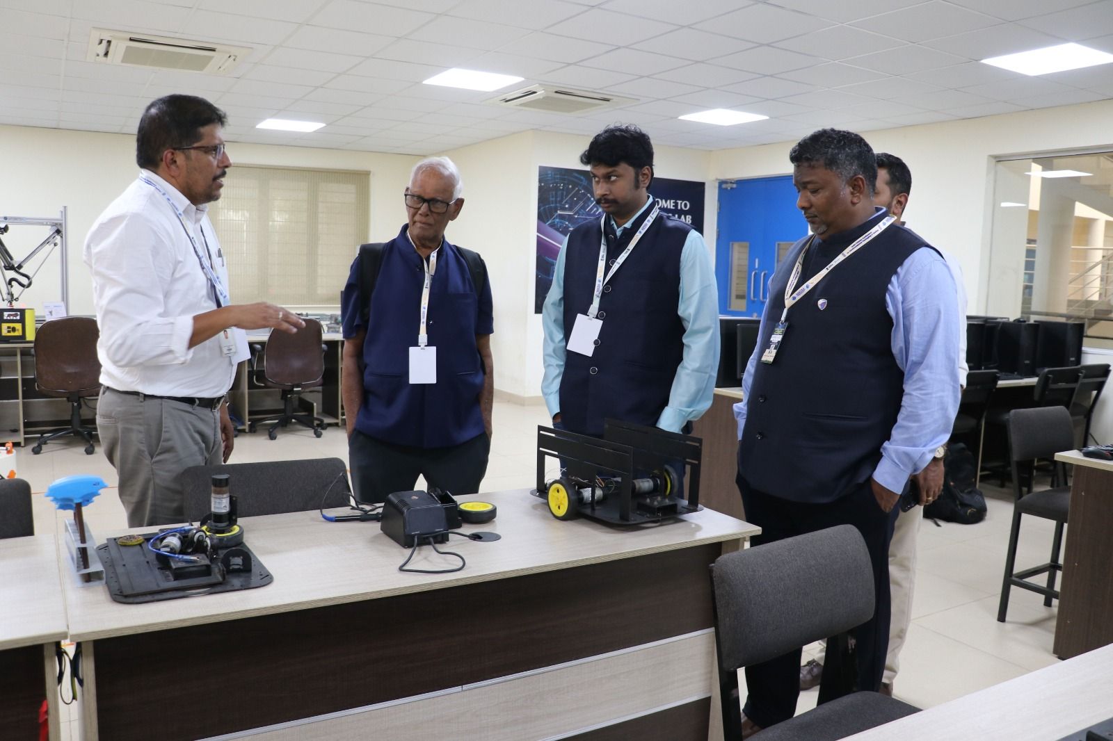 A group being walked through a semiconductor equipment laboratory