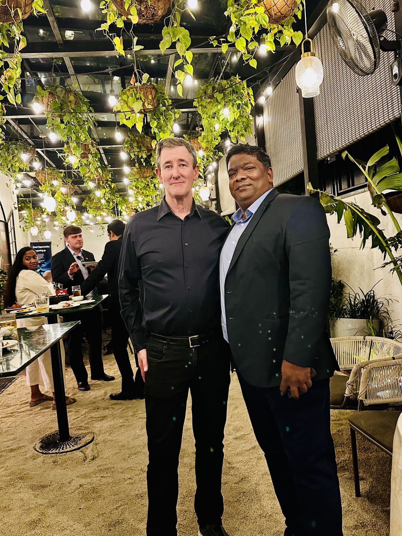 Venkatesh Kumar Pandurengan with a delegate at an evening industry reception