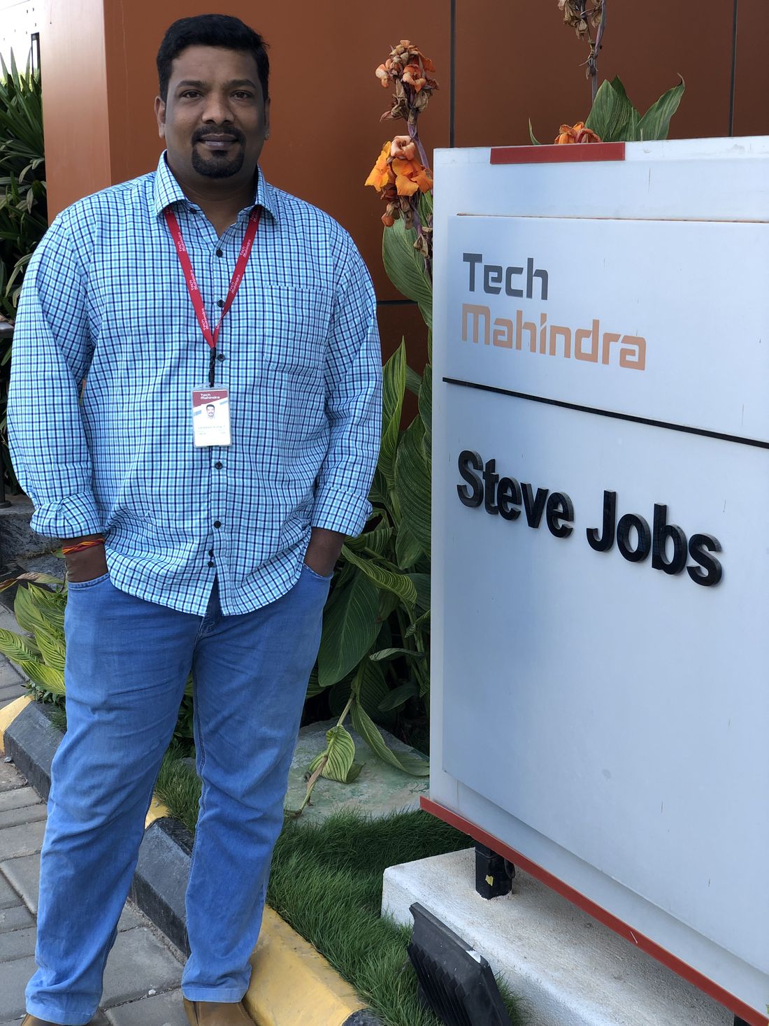 Venkatesh Kumar Pandurengan outside a Tech Mahindra campus building